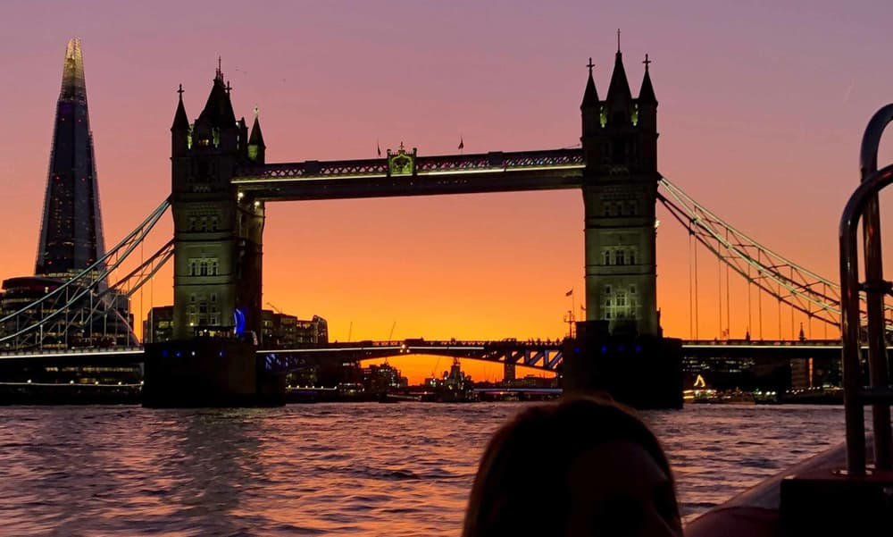 london bridge at night seen from a thames rockets speedboat trip on the thames