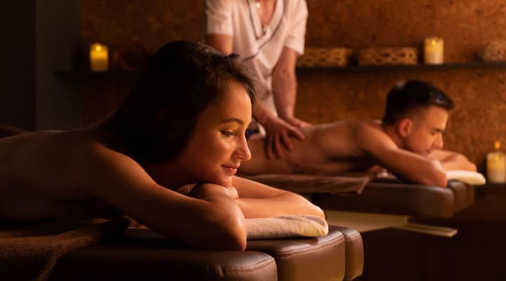 Couple having a massage treatment on a spa day