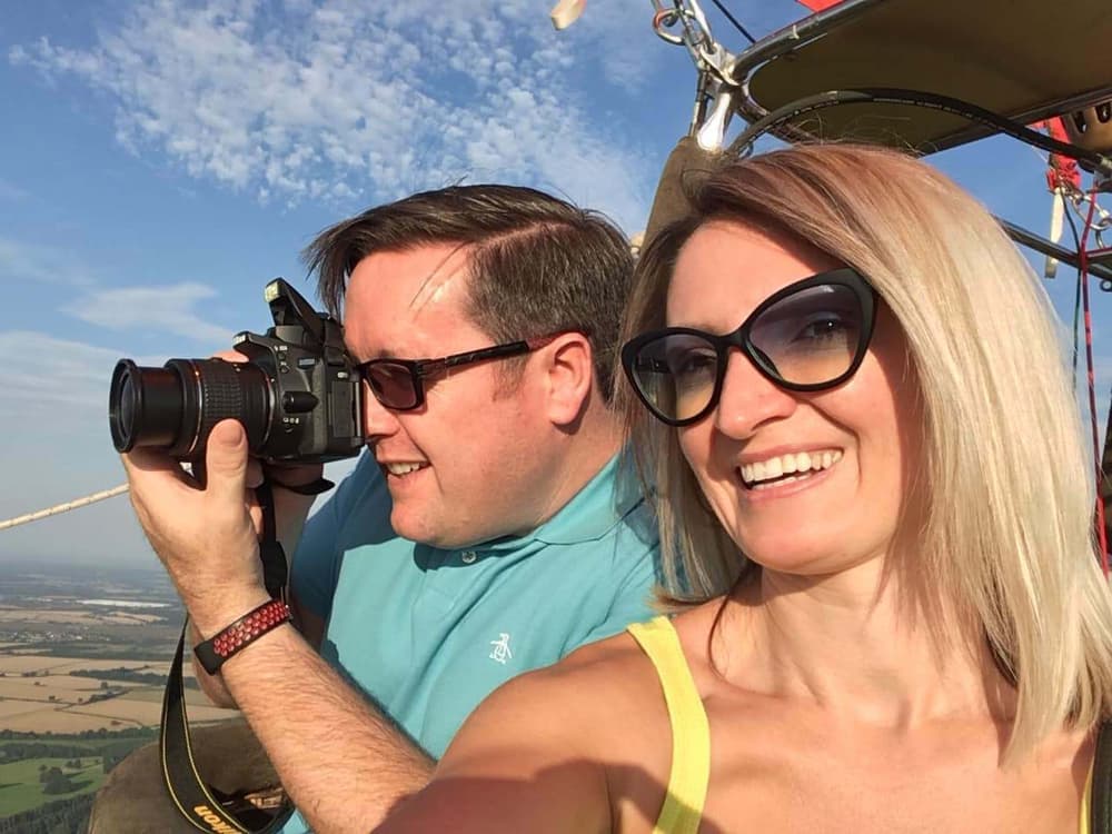 passengers taking photos on a virgin balloon flights hot air balloon ride