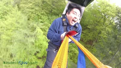 man on a bridge swinging experience day