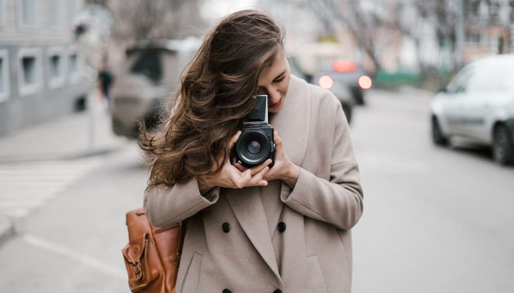 Lady taking a photo with a camera