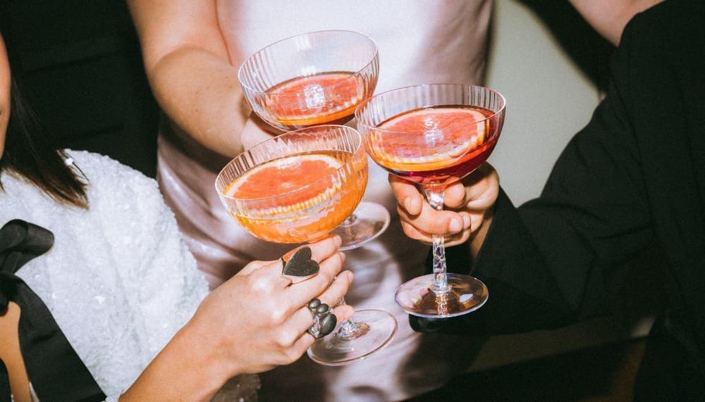 Women shaking cocktails