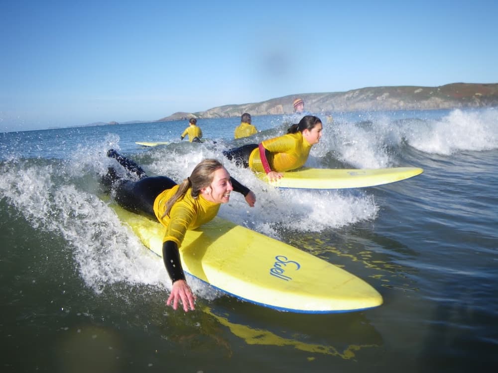 people learning how to surf on a surfing experience day