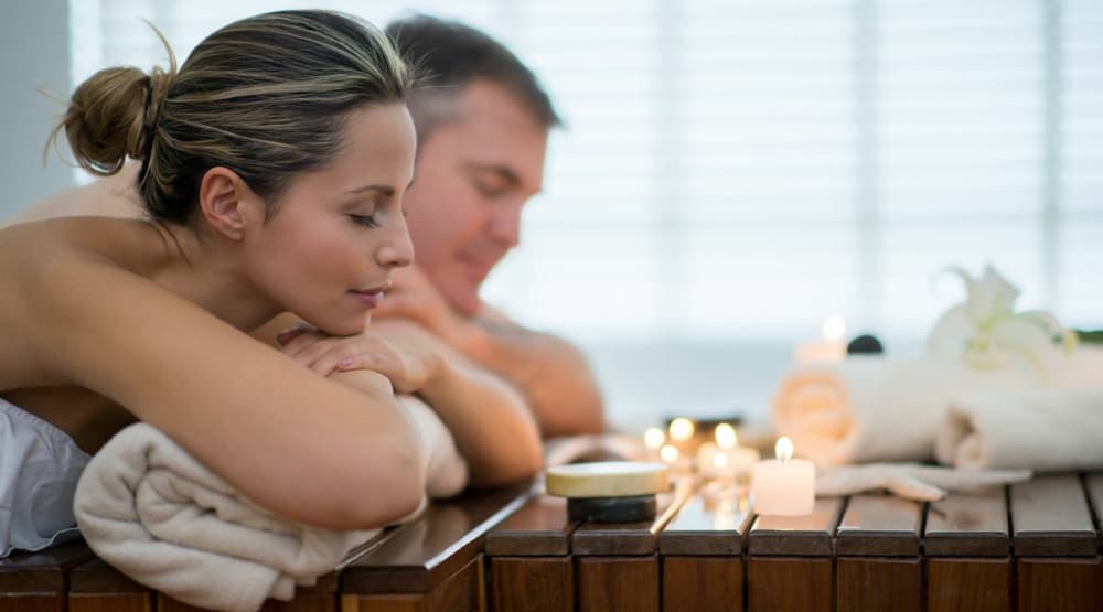 a couple having a massage on a spa day
