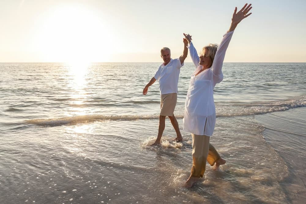 elderly couple on a beach