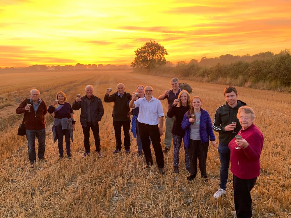 passengers enjoying a prosecco toast after a shrewsbury hot air balloon ride in shropshire