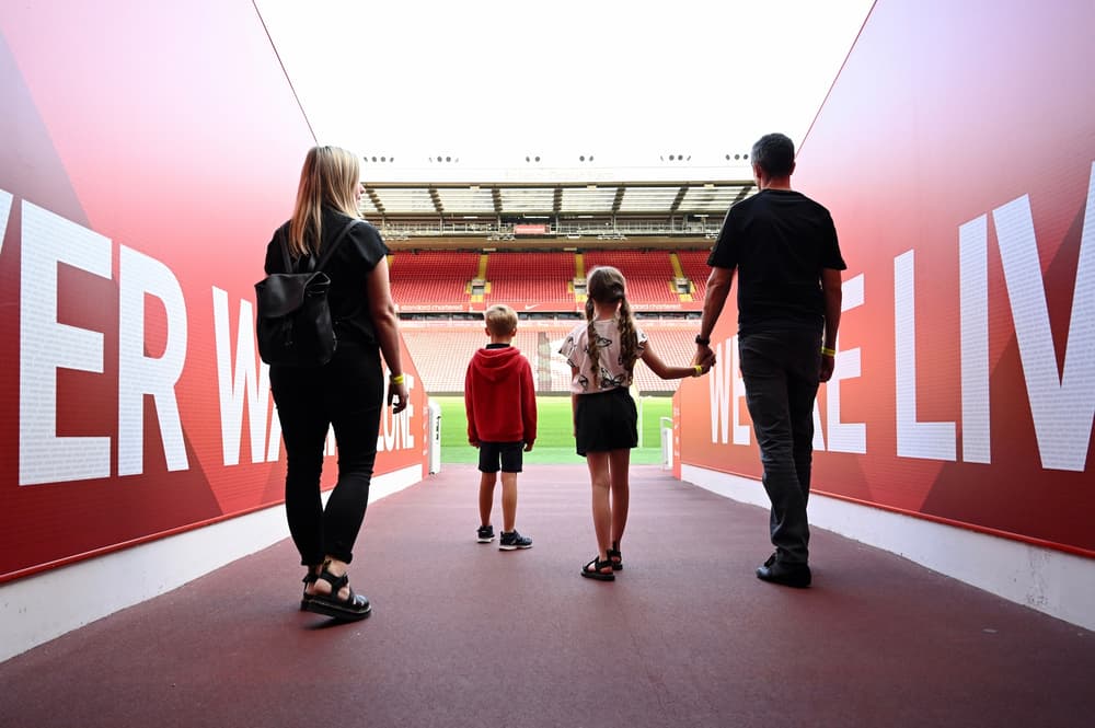family walking through the players tunnel on the liverpool fc stadium tour