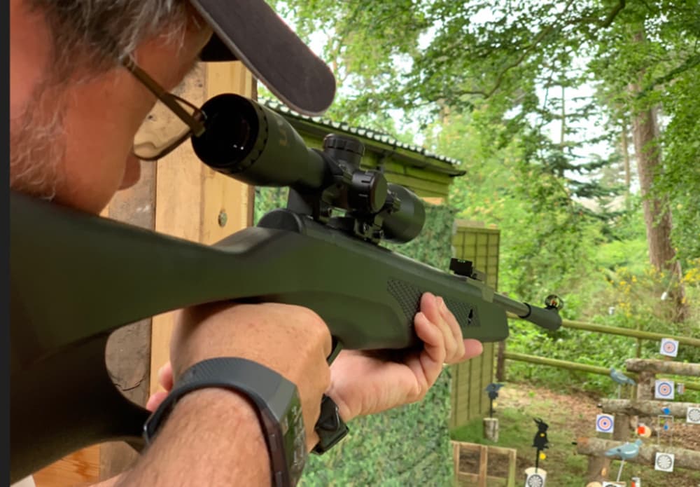 man aiming an air rifle on an air rifle experience day