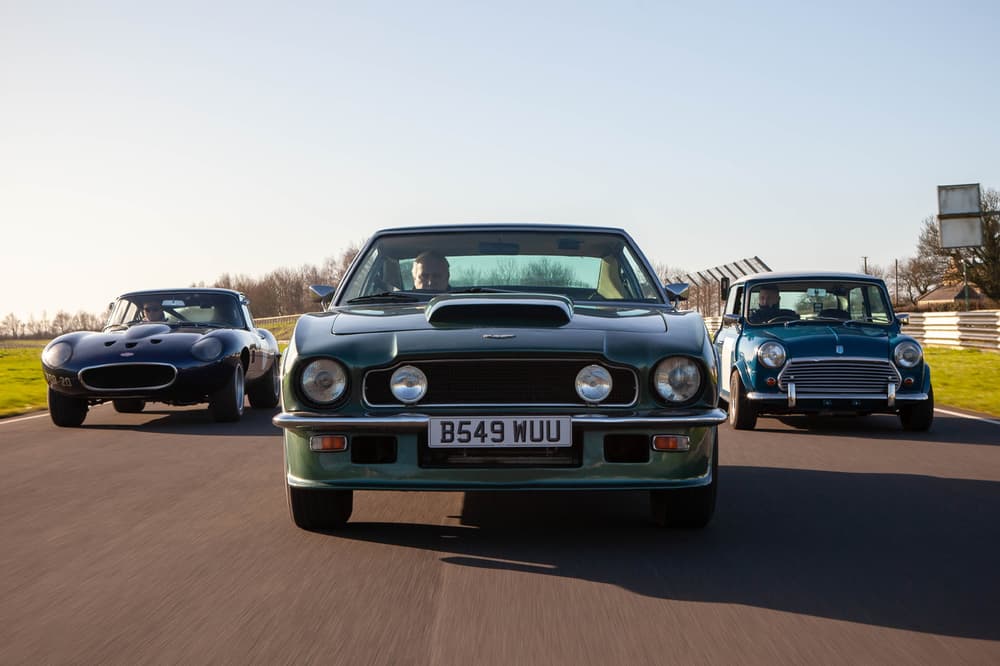 three british classic cars on a race track for a driving experience day