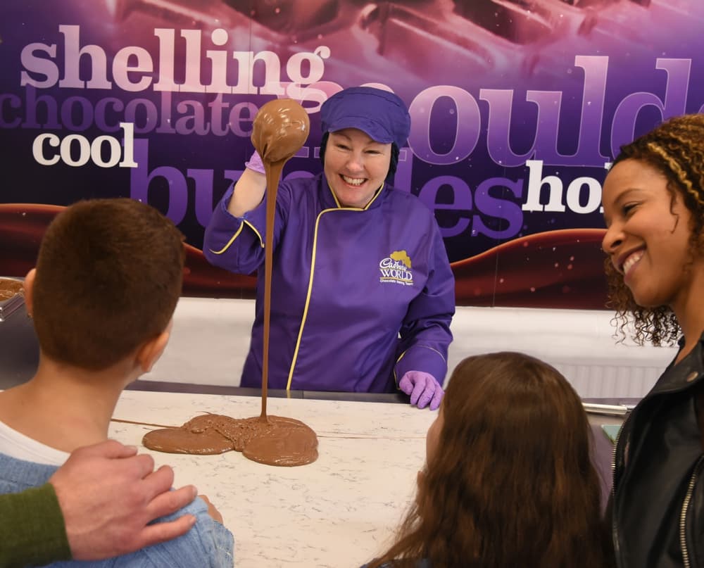 a family watching a chocolate demonstration on a visit a to cadbury world in birmingham