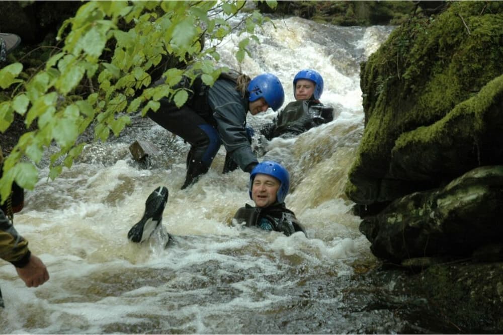 people enjoying a canyoning descent experience day