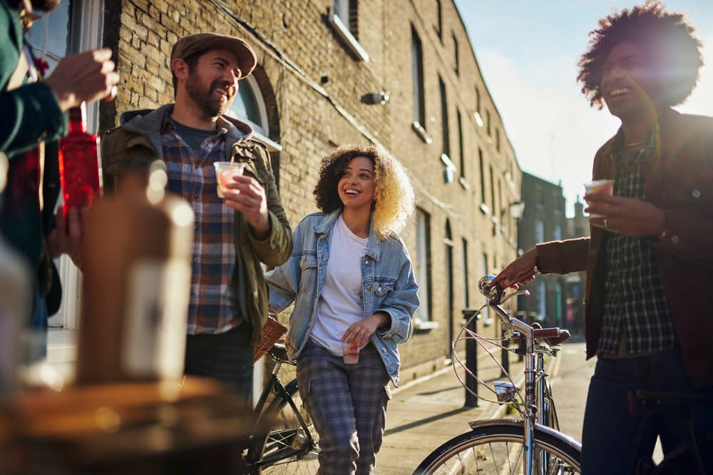 group of people enjoying a gin drink on a london gin bike tour