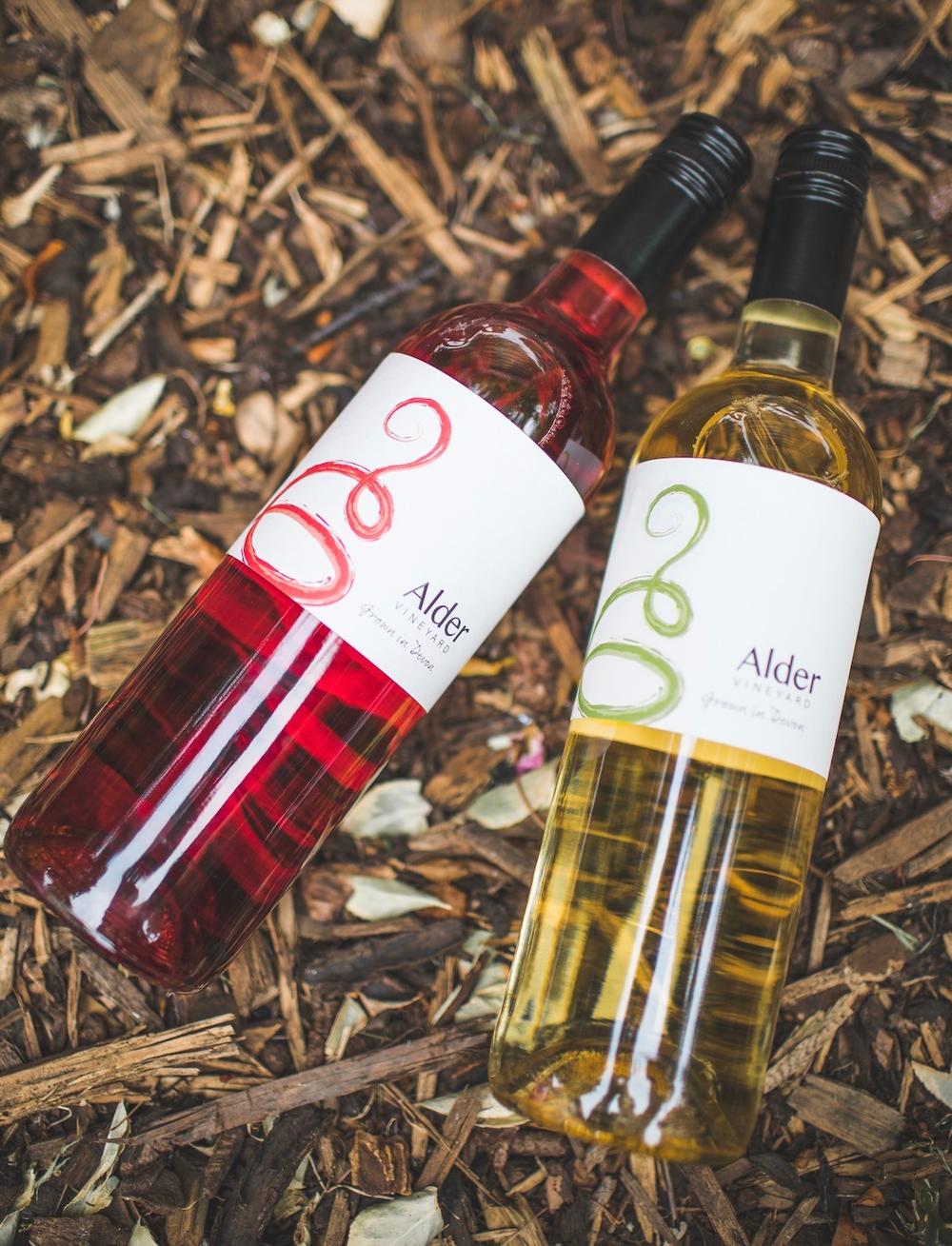 a bottle or red and a bottle of white wine from alder vineyard in devon