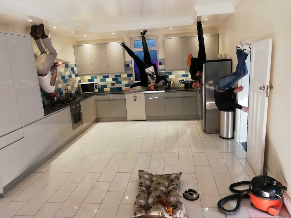 four people that look like they are walking upside down on the ceiling in a kitchen on a visit to the quirky quarter