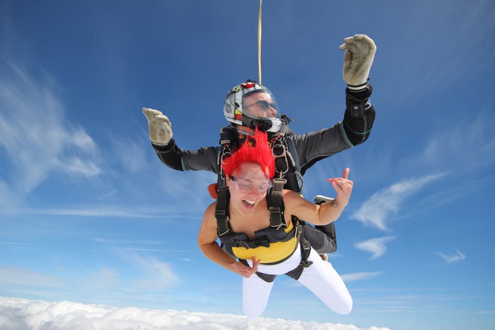 a woman on a tandem skydiving experience on freefall