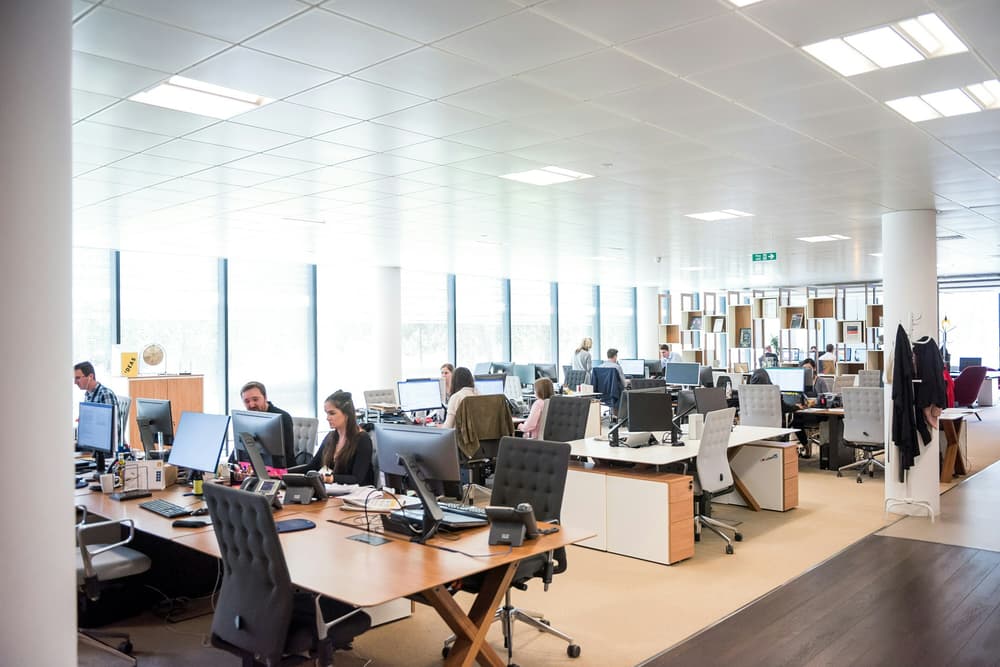open plan office space with people at working at desks