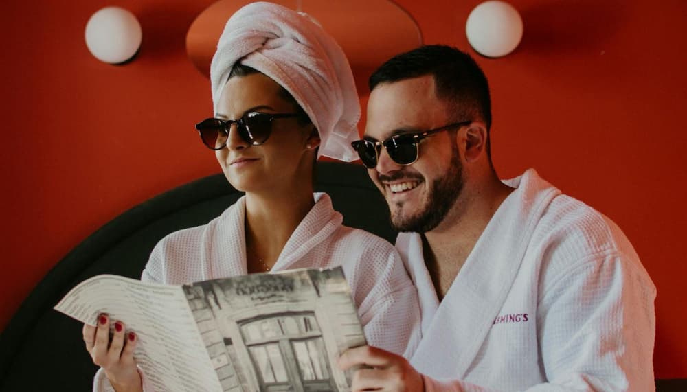 Couple in spa robes and towels