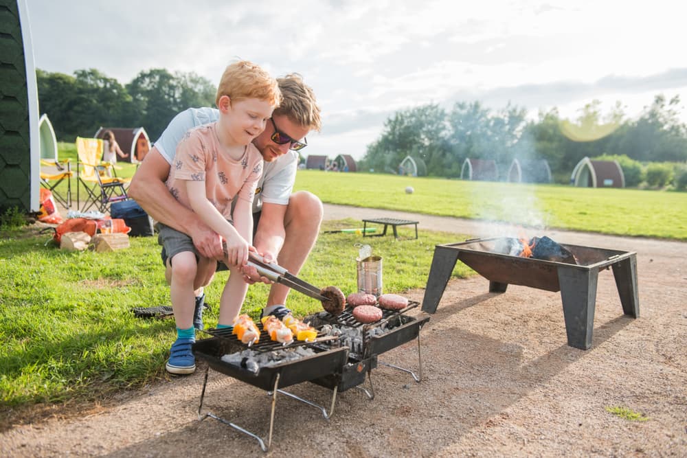 Father and son cooking on a bbq