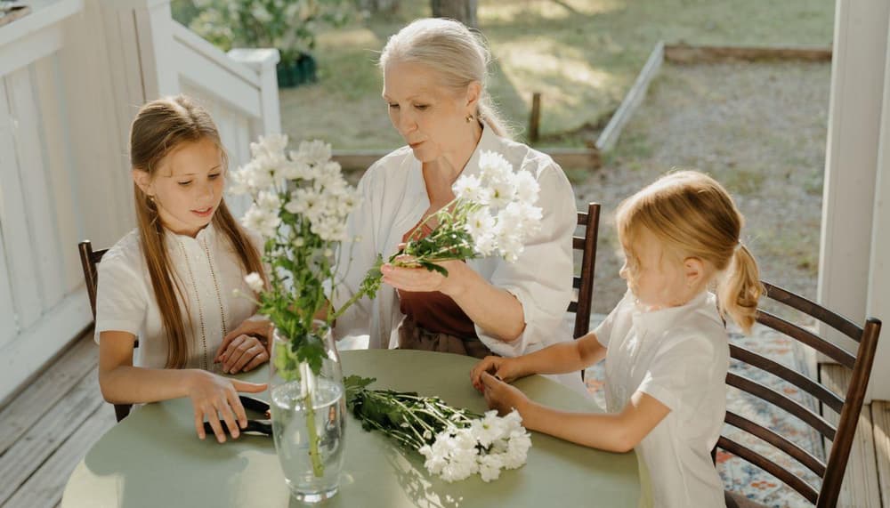 three generations of women sitting in the woods to showcase gifts for women of all ages
