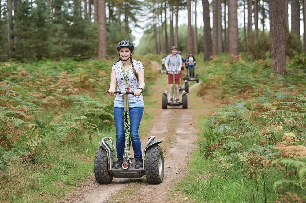 group going through forest on segways at go ape
