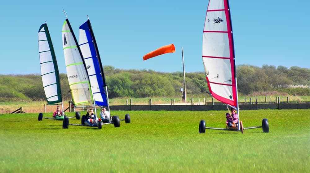 four land yachts on grass for a land yachting for groups experience day