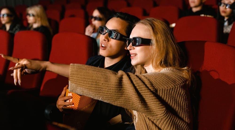 Movie goers wearing 3d glasses in cinema