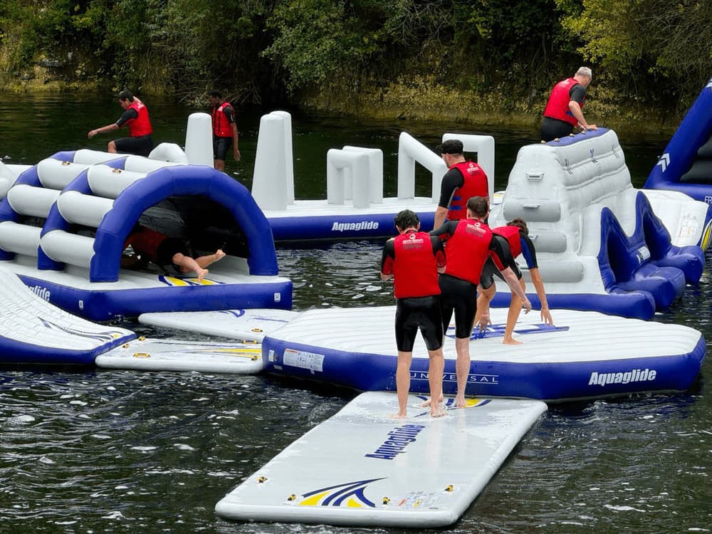 People playing on inflatable waterpark