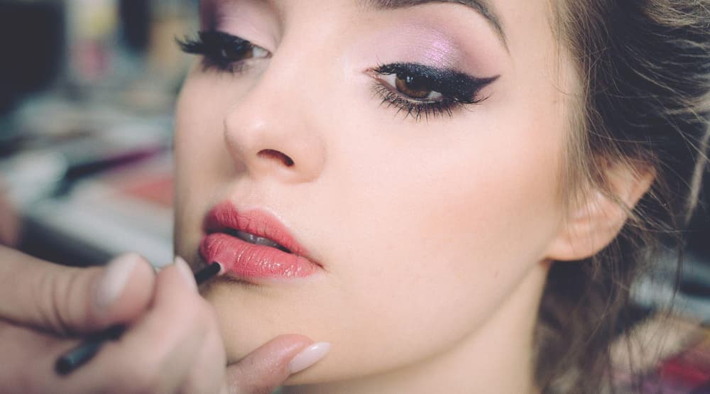 Woman having makeup applied on a makeup tutorial experience 3