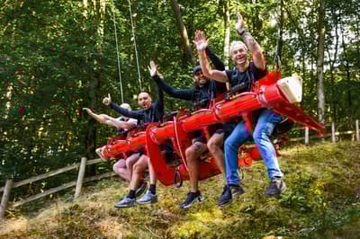 people on the zip world skyride in wales