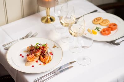 two meals laid out on a table for two at marco pierre white's london steakhouse company