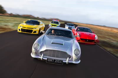 five cars on a race track for an all star track day driving experience