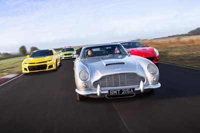 four cars on a race track for a junior all star track day experience