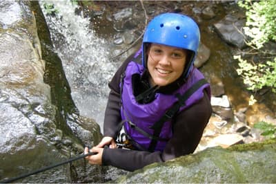 woman enjoying a canyoning descent experience day