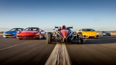 a selection of supercars on a race track at car chase heroes driving experience day