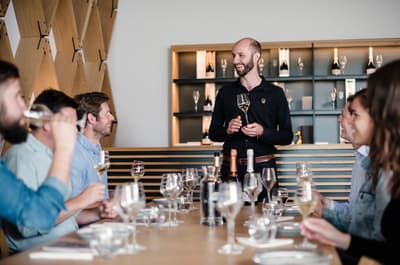 group of people enjoying a wine tasting on a tour of gusbourne estate
