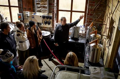 people on a distillery tour with forest distillery in cheshire