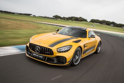 a yellow mercedes gtr on a race track during a driving experience day