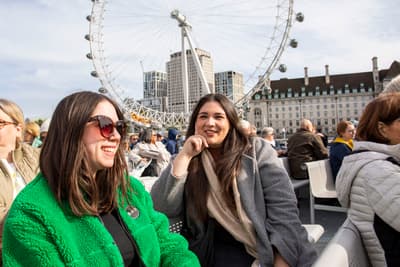 Two Guests Smiling on the London Sightseeing River Cruise