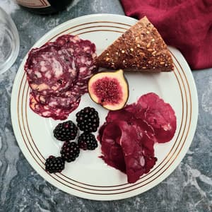 plate of charcuterie with fruit and bread made on a charcuterie making course with bray cured