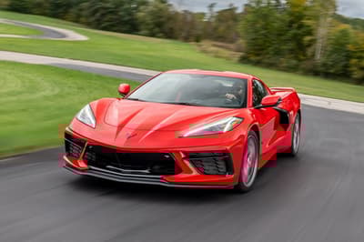 a red corvette on a race track during a driving experience day