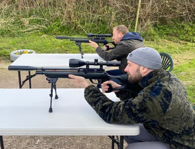 2 people on an air rifle shooting experience with rapid airgun training