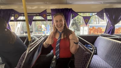 Woman smiling on the harry potter london bus tour