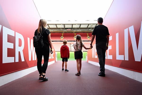 family walking through the players tunnel on the liverpool fc stadium tour