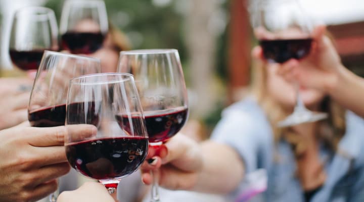 People drinking red wine