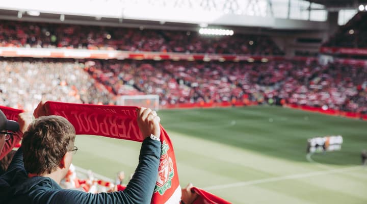 Sports fans watching football in pub