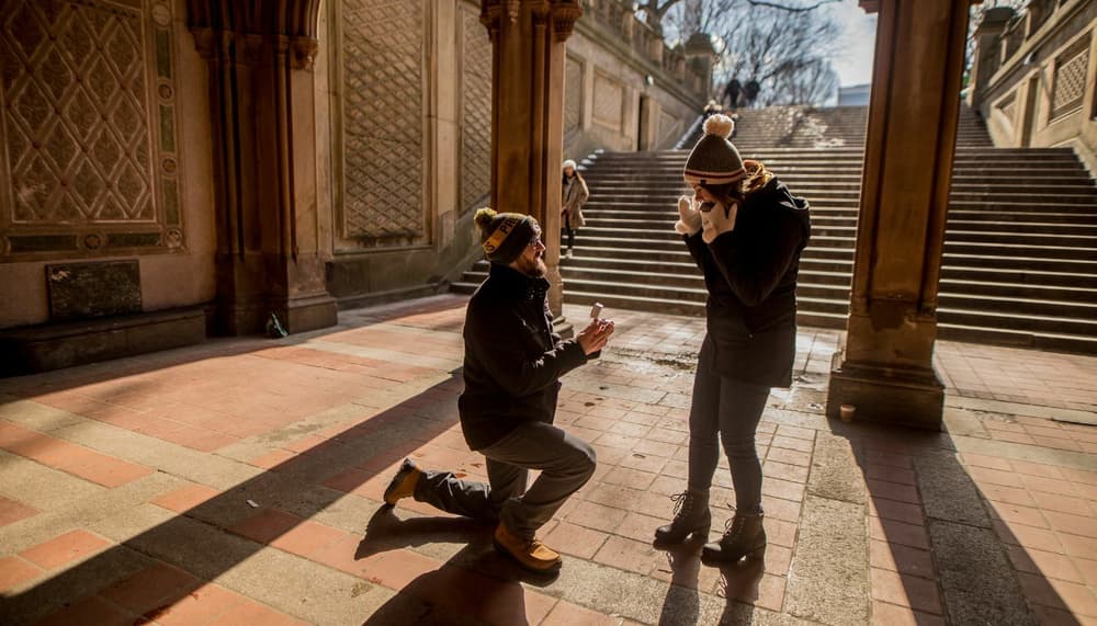 Man on one knee proposing