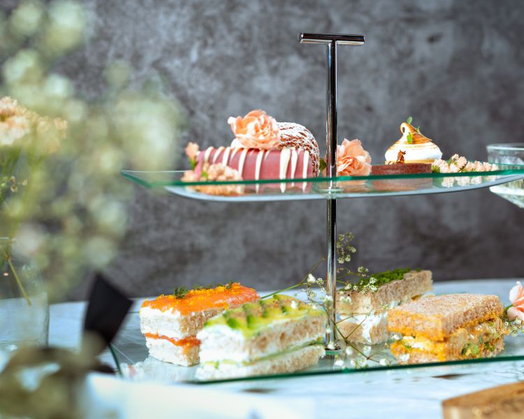 cakes and sandwiches had for the bustronome london afternoon tea