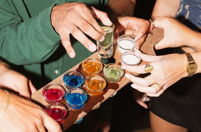 people taking shots at revolution bars