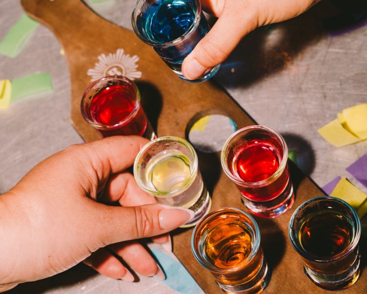board with selection of shots at revolution bars