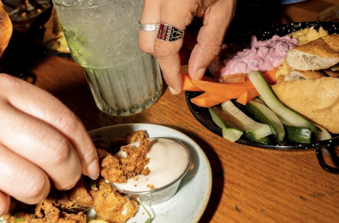 plates of food with drinks for a bottomless drinks with food experience at revolution bars